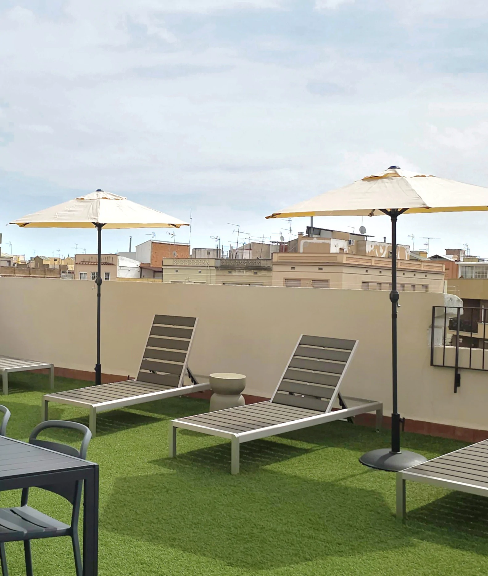 Terrace with sun loungers and city views in L’Hospitalet de Llobregat, Barcelona